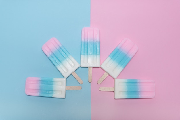 Free Photo ice cream over blue and pink background