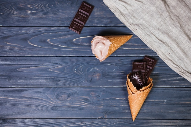 Ice-cream and chocolate on table