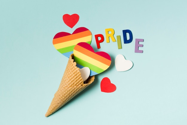 Free Photo ice cream cone with hearts in rainbow colors