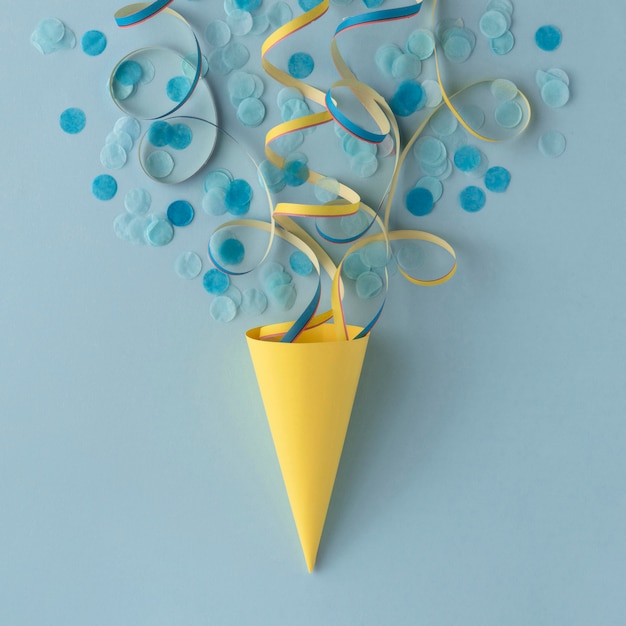 Free photo ice cream paper cone and confetti