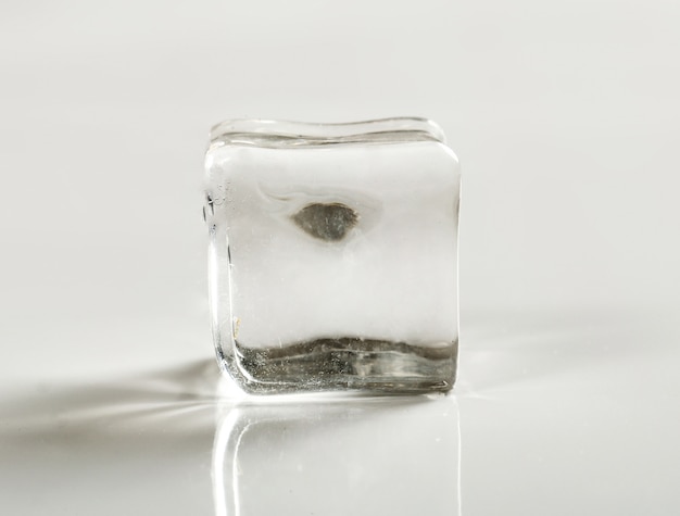 Free photo ice cube on white table