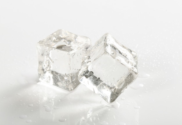 Ice cubes on white table