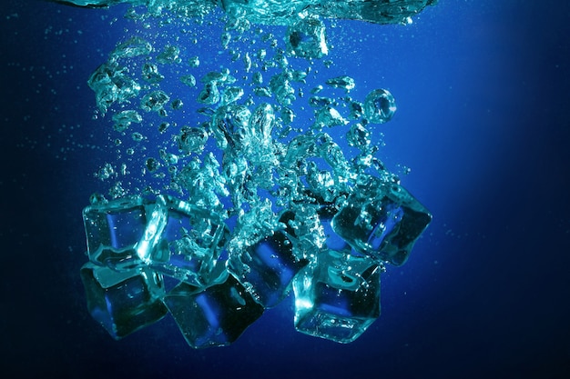 Ice cubes with bubbles underwater