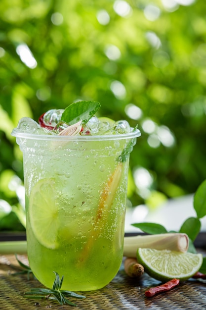 Ice herbal tea on wooden surface