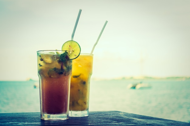 Ice mojito drinking glass with tropical sea ocean