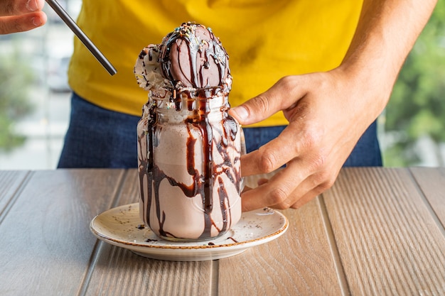 Icecream dessert with bitter chocolate sauce