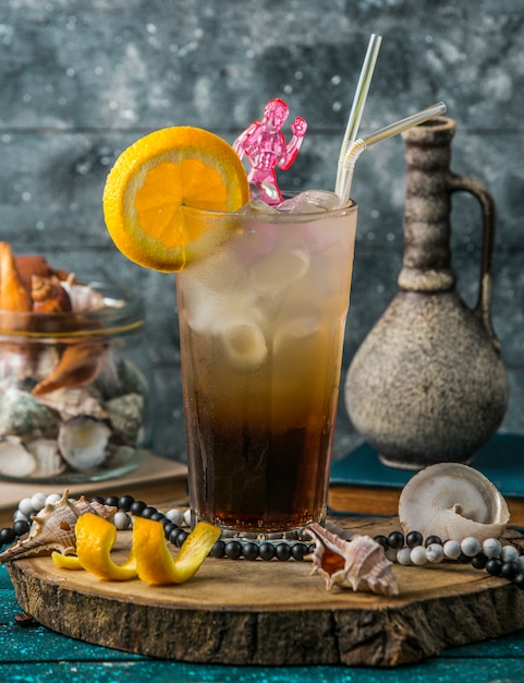 iced cocktail garnished with orange slice