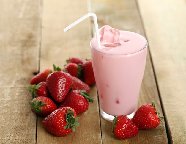 Iced pink cocktail and fresh strawberries