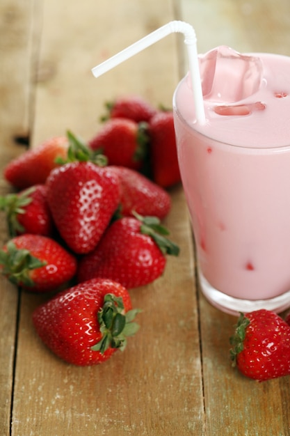 Iced pink cocktail and fresh strawberries