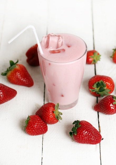 Iced pink cocktail and fresh strawberries