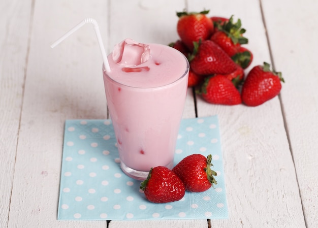 Iced pink cocktail and fresh strawberries