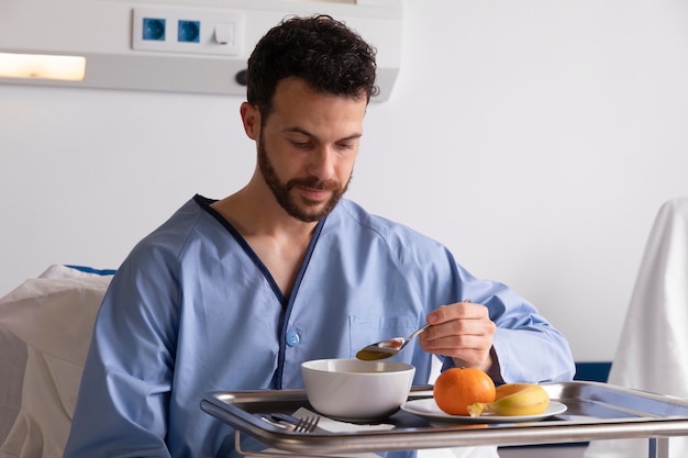 Ill male patient in bed at the hospital