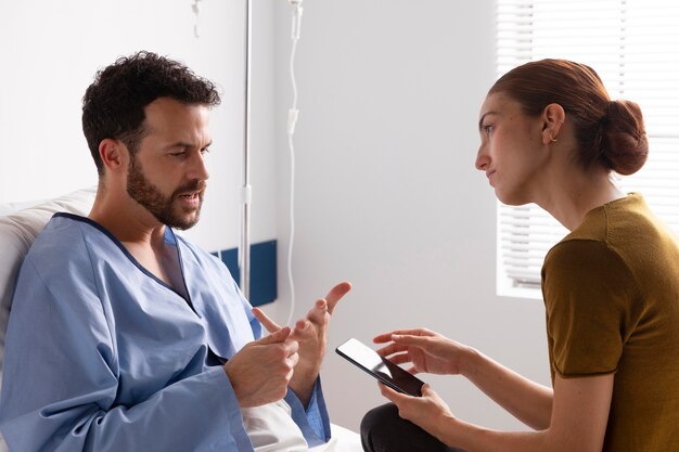 Ill patient talking to his wife