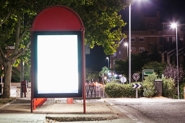 Free photo illuminated blank billboard for advertisement at bus station