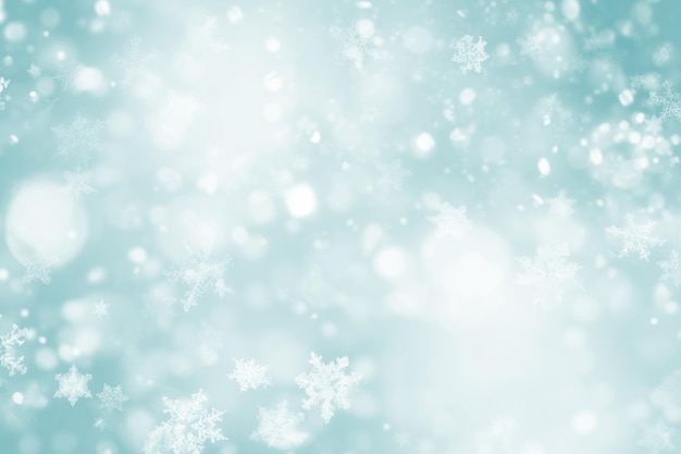 Free photo image of blue blurred lights with small snowflakes on a blue background