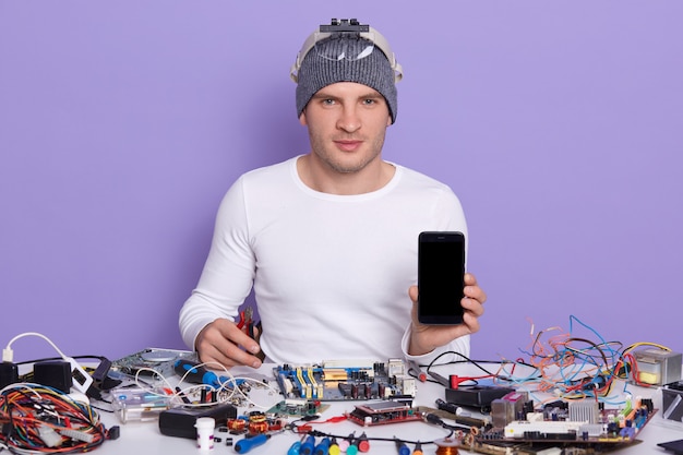 Free photo image of confident professional radiotrician sitting at his workplace