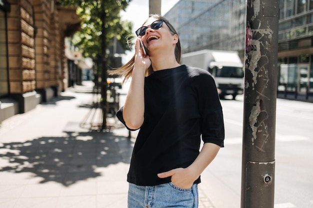 Free photo image of cute woman luffing with phone in the city