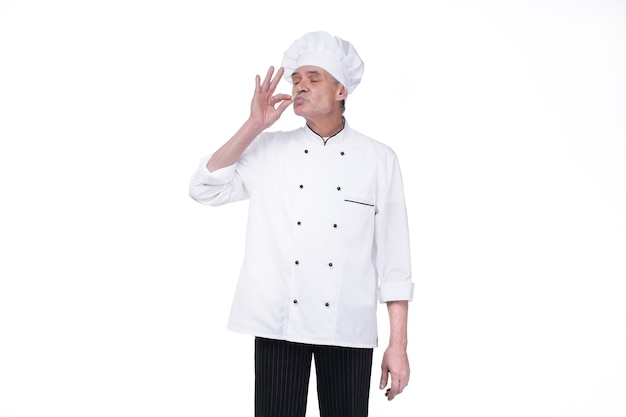 Free photo image of handsome senior man chef indoors isolated over white wall