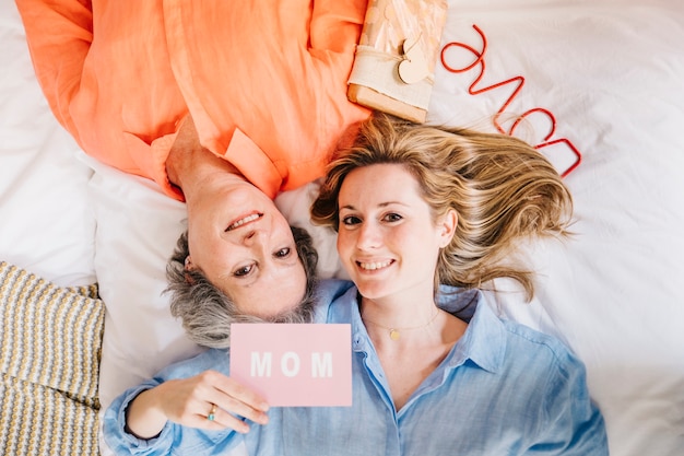 Image of mother and daughter on bed