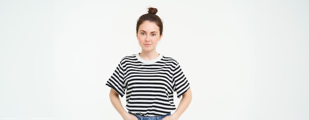 Free Photo image of young confident woman in casual outfit looking happy standing against white background