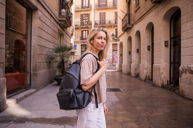 Free photo image of young woman with backpack in the city