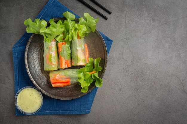 Free photo imitation crab stick fresh vegetable salad rolls