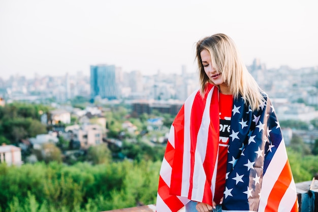 Independence day concept with girl on rooftop