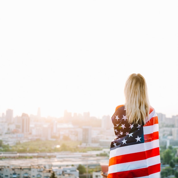 Independence day concept with girl on rooftop