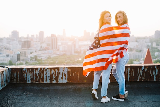 Independence day concept with girls on rooftop