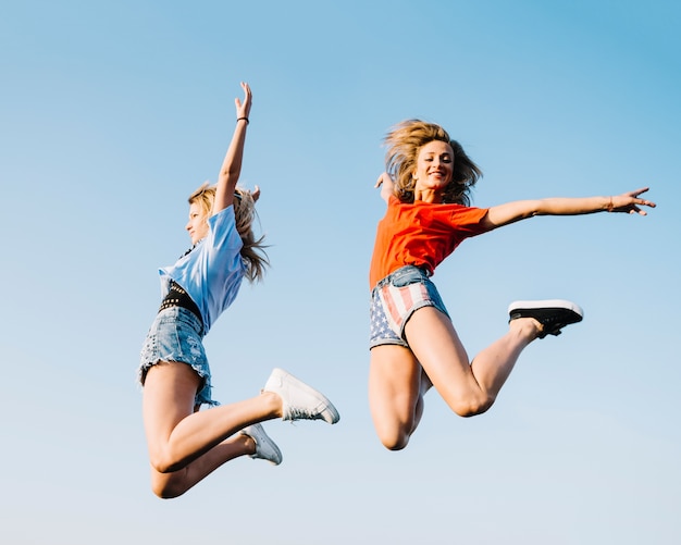 Free photo independence day concept with jumping girls