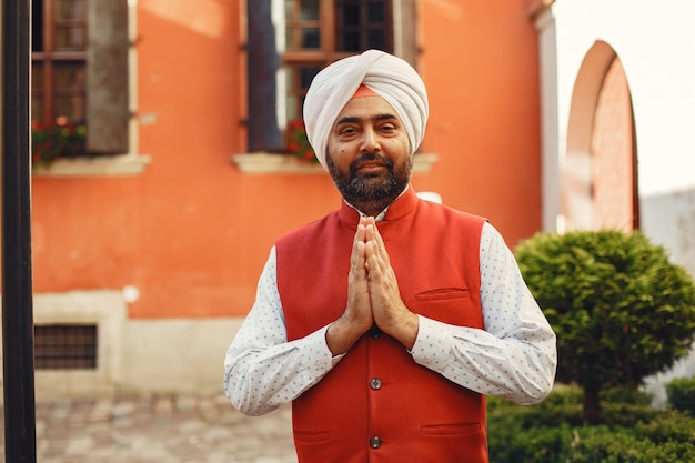 Free Photo indian man in a city. male in a traditional turban. hinduist in a summer city.