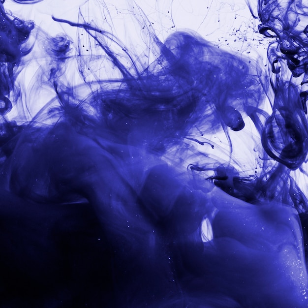 Indigo colored ink underwater 