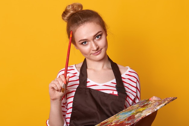 Free Photo indoor shot of thoughtful creative artist with paint equipment