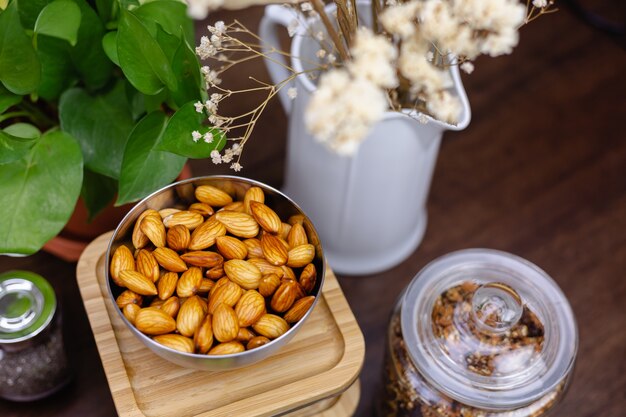 Ingredients for healthy dessert chia puddings in kitchen on wooden table