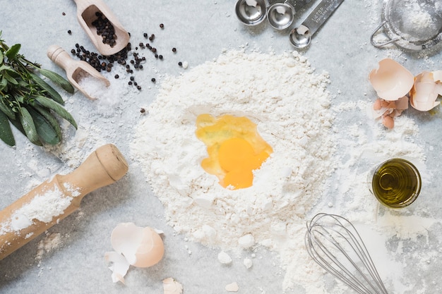 Free Photo ingredients for making dough for bread; cake on marble top