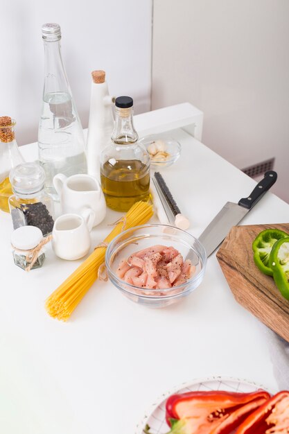 Ingredients for making the spaghetti on white table