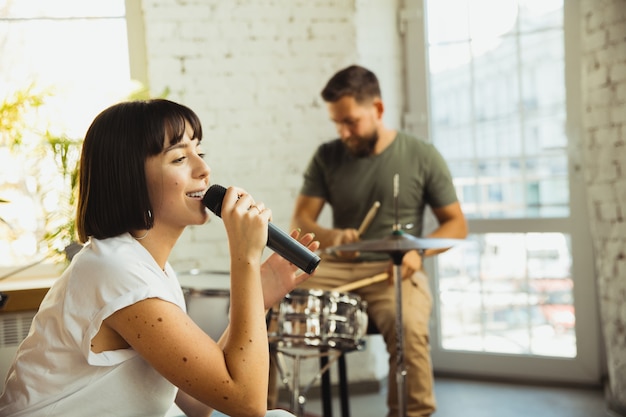 Free photo inspiration. musician band jamming together in art workplace with instruments.