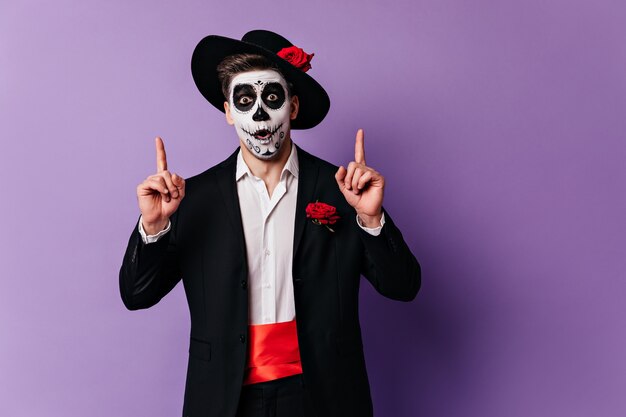 Inspired guy with Mexican-style face-art came up with great idea about Halloween party.