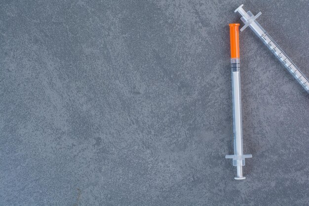 Insulin syringes for diabetes on marble surface