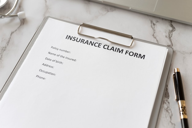 Free Photo insurance claim form high angle