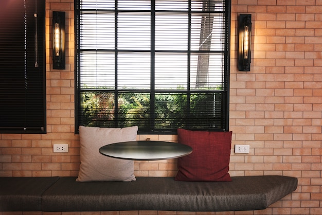 Free photo interior of a cafe with brick walls