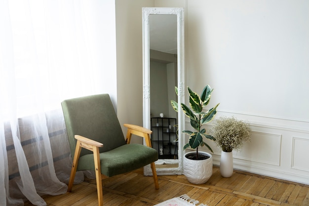 Free photo interior decor with mirror and potted plant