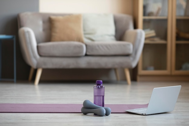 Interior design with yoga mat and dumbbells