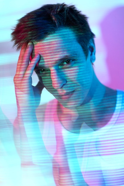 Free Photo interior portrait of handsome man in vaporwave style