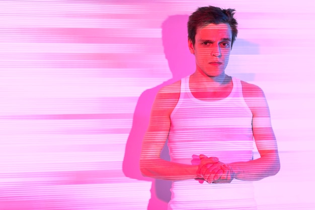 Free photo interior portrait of handsome man in vaporwave style