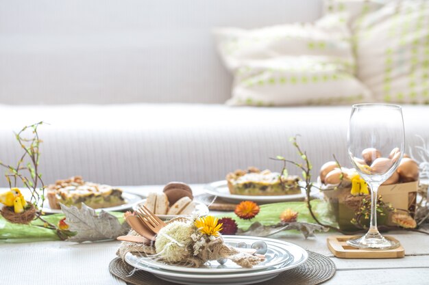 The interior of the room with a festive Easter table .