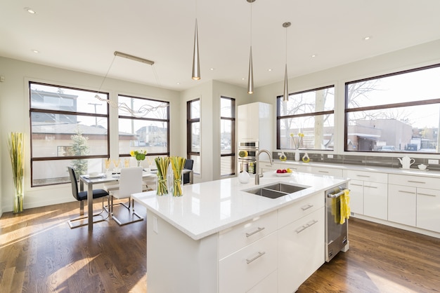 Free photo interior shot of a modern house kitchen with large windows