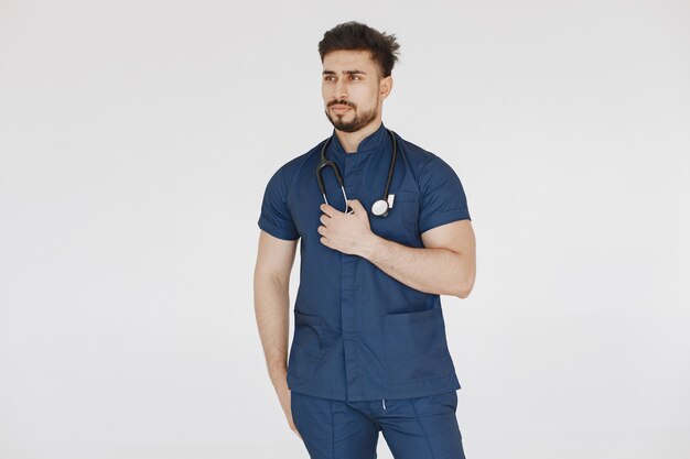 International medical student. Man in a blue uniform. Doctor with stethoscope.