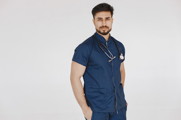 International medical student. Man in a blue uniform. Doctor with stethoscope.