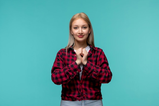 Free Photo international students day young cute girl in red checked shirt holding hands together